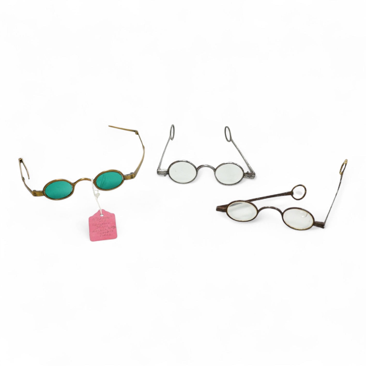 A pair of 18th century steel temple spectacles, a similar pair of iron spectacles, with written note dating them to 1796, and a pair of German? brass framed spectacles with green tinted lenses (3)
